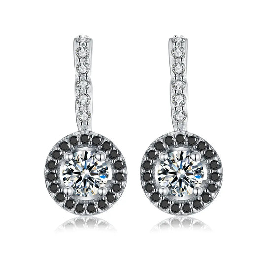 Elegant silver earrings featuring round clear diamonds surrounded by a halo of black stones and sparkling accents on the hooks.