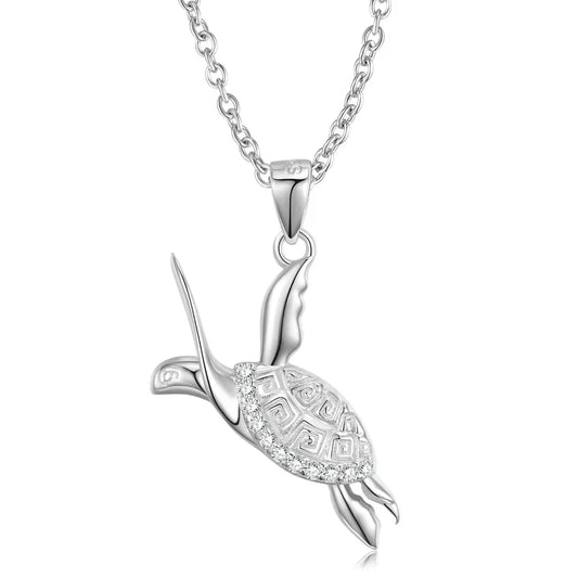 Silver turtle pendant necklace with intricate detailing and sparkling accents, suspended from a delicate chain.
