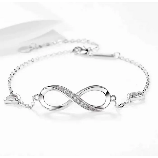 Silver infinity bracelet adorned with sparkling stones, symbolizing eternal love and connection.