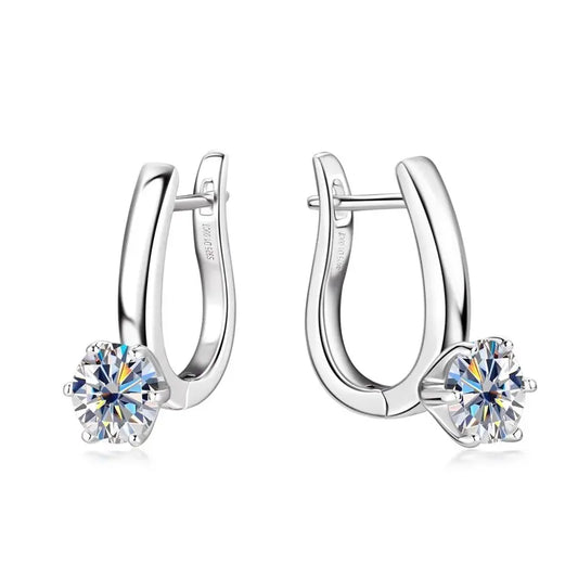 Elegant silver hoop earrings featuring sparkling round gemstones, showcasing a timeless and sophisticated design.